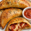 Crispy homemade pizza pockets filled with melted mozzarella cheese