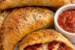 Crispy homemade pizza pockets filled with melted mozzarella cheese